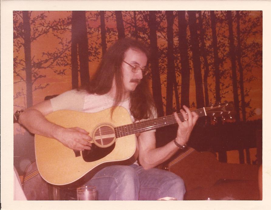 Dad playing a Martin acoustic in the 70s