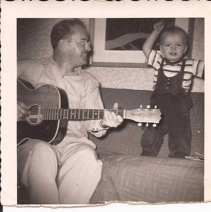 With his dad and the Larson Brothers guitar